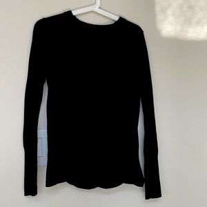 This jet black lululemon sweater have thumbhole and open back in pristine con